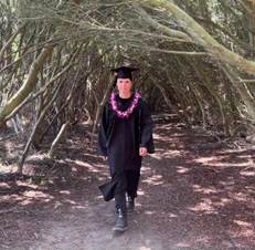 A person standing in a wooded area